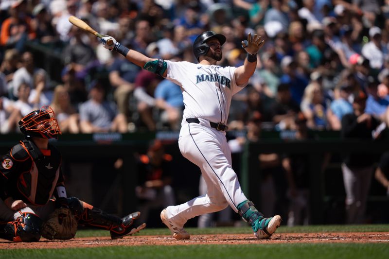 Jun 5, 2025; Seattle, Washington, USA;  Seattle Mariners catcher Cal Raleigh (29) hits a two-run home run during the fifth inning against the Baltimore Orioles at T-Mobile Park. Mandatory Credit: Stephen Brashear-Imagn Images