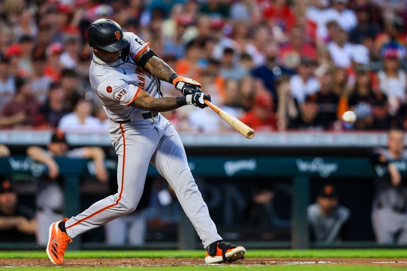 Aug 2, 2024; Cincinnati, Ohio, USA; San Francisco Giants designated hitter Marco Luciano (37) hits a single against the Cincinnati Reds in the second inning at Great American Ball Park. Mandatory Credit: Katie Stratman-USA TODAY Sports