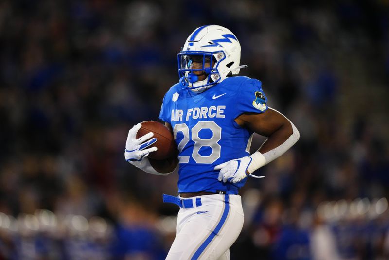 Sep 23, 2022; Colorado Springs, Colorado, USA; Air Force Falcons fullback Emmanuel Michel (28) scores a rushing touchdown in the third quarter against the Nevada Wolf Pack at Falcon Stadium. Mandatory Credit: Ron Chenoy-USA TODAY Sports