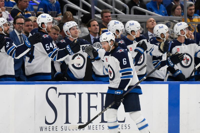 Oct 22, 2024; St. Louis, Missouri, USA; Winnipeg Jets defenseman Colin Miller (6) is congratulated by teammates after scoring a goal against the St. Louis Blues during the second period at Enterprise Center. Mandatory Credit: Jeff Le-Imagn Images 