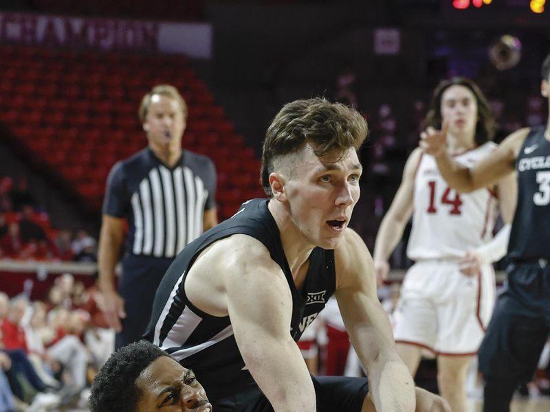 Jan 4, 2023; Norman, Oklahoma, USA; Iowa State Cyclones guard Caleb Grill (2) works to steal the ball from Oklahoma Sooners guard Grant Sherfield (25) as he calls for a time out during the second half at Lloyd Noble Center. Iowa State won 63-60. Mandatory Credit: Alonzo Adams-USA TODAY Sports