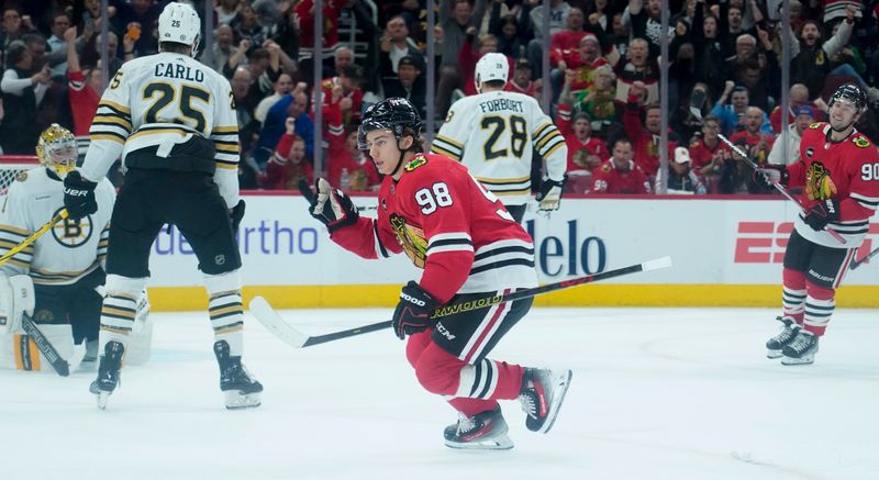 Oct 24, 2023; Chicago, Illinois, USA; Chicago Blackhawks center Connor Bedard (98) celebrates a goal against the Boston Bruins that was taken away because of a offside call during the first period against the Boston Bruins at United Center. Mandatory Credit: David Banks-USA TODAY Sports