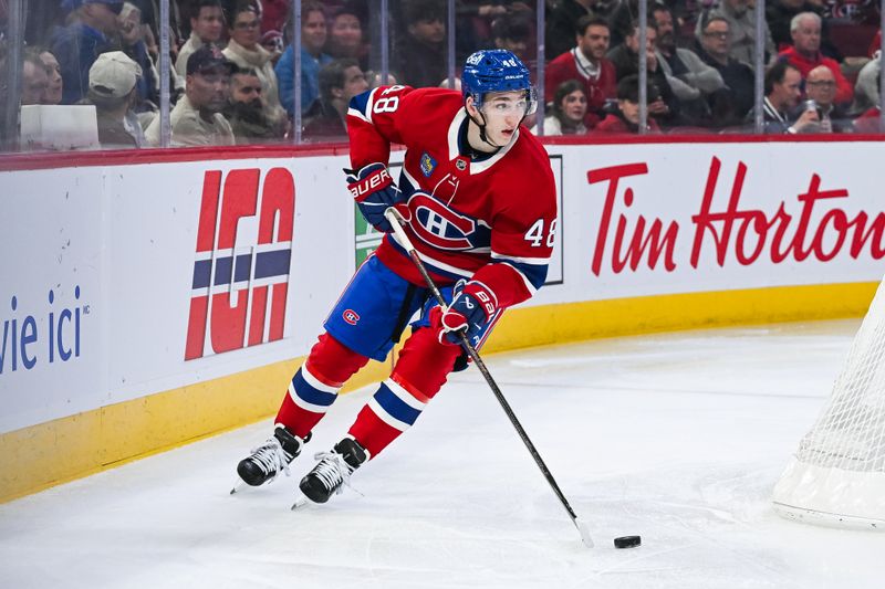 Oct 16, 2025; Montreal, Quebec, CAN; Montreal Canadiens defenseman Lane Hutson (48) plays the puck against the Nashville Predators during the first period at Bell Centre. Mandatory Credit: David Kirouac-Imagn Images