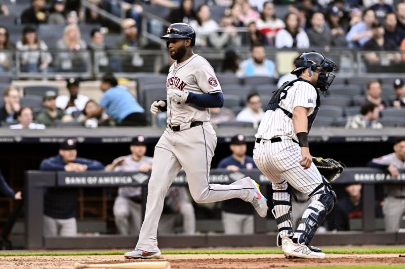 May 9, 2024; Bronx, New York, USA; Houston Astros outfielder Yordan Alvarez (44) scores a run on a RBI single by Houston Astros shortstop Jeremy Pena (not pictured) during the fifth inning against the New York Yankees at Yankee Stadium. Mandatory Credit: John Jones-USA TODAY Sports