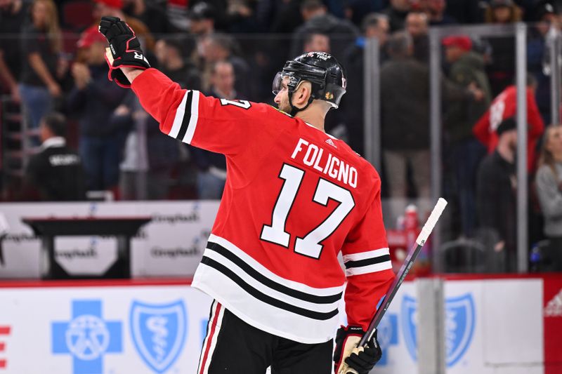 Apr 14, 2024; Chicago, Illinois, USA; Chicago Blackhawks forward Nick Foligno (17) waves to the crowd after a game against the Carolina Hurricanes at United Center. Mandatory Credit: Jamie Sabau-USA TODAY Sports