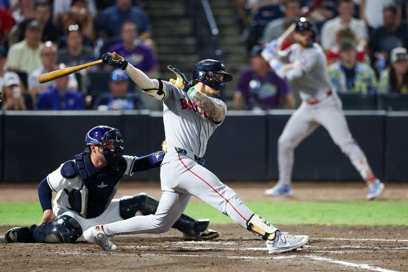 Sep 20, 2025; Tampa, Florida, USA; Boston Red Sox left fielder Jarren Duran (16) singles against the Tampa Bay Rays in the third inning at George M. Steinbrenner Field. Mandatory Credit: Nathan Ray Seebeck-Imagn Images