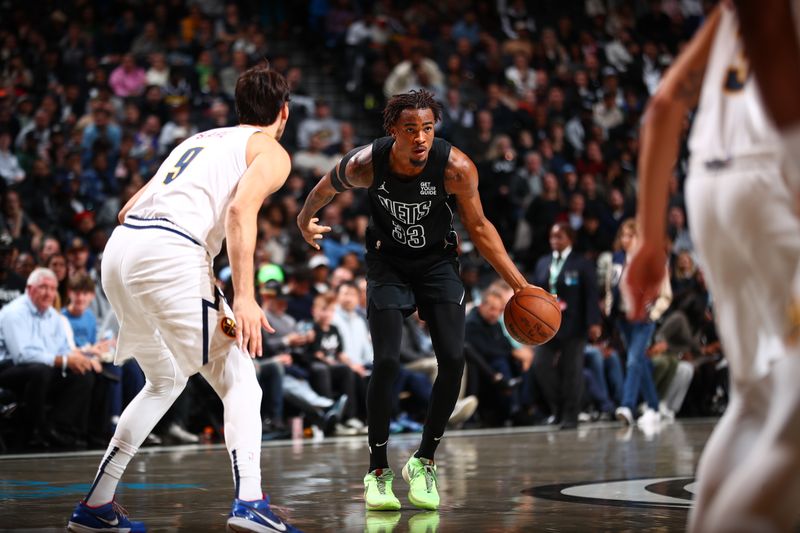 BROOKLYN, NY - OCTOBER 29: Nicolas Claxton #33 of the Brooklyn Nets handles the ball during the game against the Denver Nuggets on October 29, 2024 at Barclays Center in Brooklyn, New York. NOTE TO USER: User expressly acknowledges and agrees that, by downloading and or using this Photograph, user is consenting to the terms and conditions of the Getty Images License Agreement. Mandatory Copyright Notice: Copyright 2024 NBAE (Photo by David L. Nemec/NBAE via Getty Images)