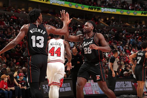 CHICAGO, IL - NOVEMBER 12: James Wiseman #13 of the Detroit Pistons high fives Isaiah Stewart #28 of the Detroit Pistons during the game against the Chicago Bulls on November 12, 2023 at United Center in Chicago, Illinois. NOTE TO USER: User expressly acknowledges and agrees that, by downloading and or using this photograph, User is consenting to the terms and conditions of the Getty Images License Agreement. Mandatory Copyright Notice: Copyright 2023 NBAE (Photo by Gary Dineen/NBAE via Getty Images)