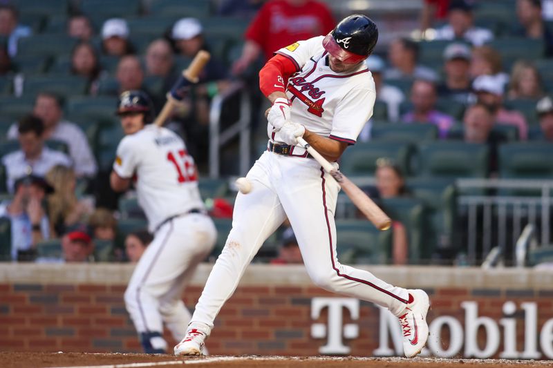 May 14, 2025; Atlanta, Georgia, USA; Atlanta Braves first baseman Matt Olson (28) hits a single against the Washington Nationals in the fourth inning at Truist Park. Mandatory Credit: Brett Davis-Imagn Images
