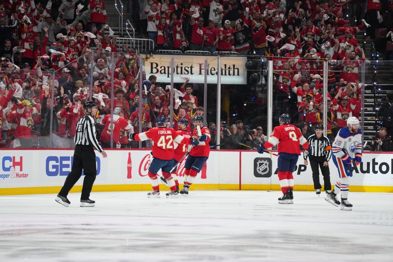 Jun 10, 2024; Sunrise, Florida, USA; Florida Panthers forward Evan Rodrigues (17) celebrates scoring against the Edmonton Oilers during the third period in game two of the 2024 Stanley Cup Final at Amerant Bank Arena. Mandatory Credit: Jim Rassol-USA TODAY Sports