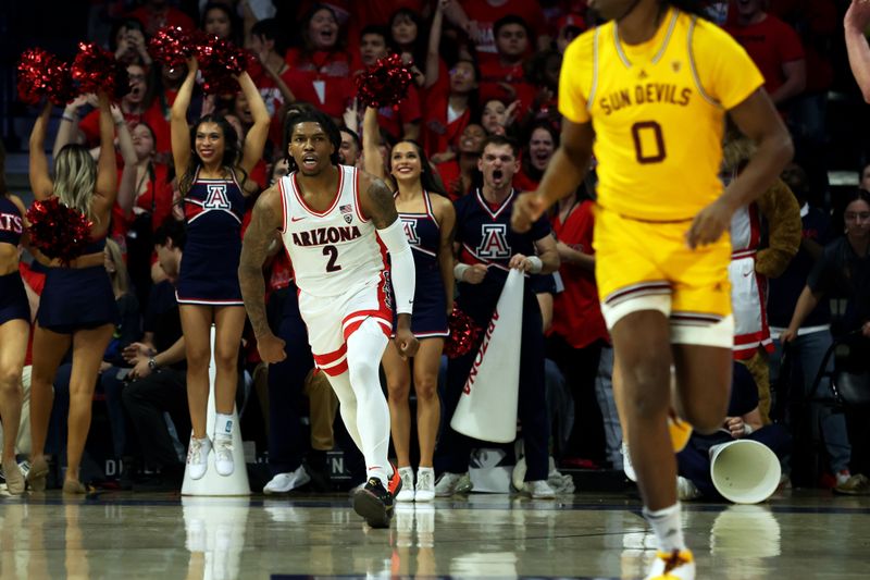 Feb 17, 2024; Tucson, Arizona, USA; Arizona Wildcats guard Caleb Love (2) makes a basket agaisnt Arizona State Sun Devils guard Kamari Lands (0) during the first half at McKale Center. Mandatory Credit: Zachary BonDurant-USA TODAY Sports