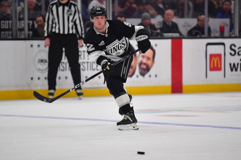 Jan 20, 2026; Los Angeles, California, USA; Los Angeles Kings defenseman Brandt Clarke (92) passes the puck against the New York Rangers during the second period at Crypto.com Arena. Mandatory Credit: Gary A. Vasquez-Imagn Images