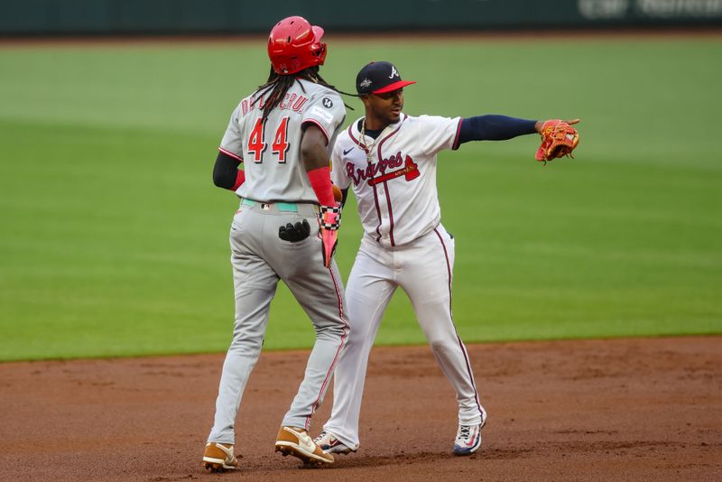 May 7, 2025; Atlanta, Georgia, USA; Atlanta Braves second baseman Ozzie Albies (1) reacts after tagging out Cincinnati Reds shortstop Elly De La Cruz (44) in the first inning at Truist Park. Mandatory Credit: Brett Davis-Imagn Images
