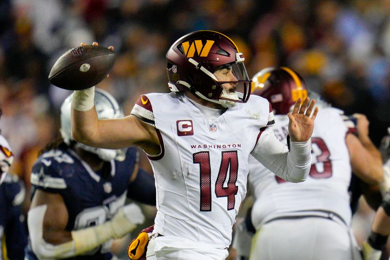 Washington Commanders quarterback Sam Howell (14) throws the ball during the first half of an NFL football game against the Dallas Cowboys, Sunday, Jan. 7, 2024, in Landover, Md. (AP Photo/Jessica Rapfogel)