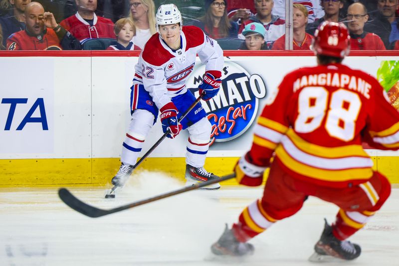 Mar 16, 2024; Calgary, Alberta, CAN; Montreal Canadiens right wing Cole Caufield (22) controls the puck against the Calgary Flames during the first period at Scotiabank Saddledome. Mandatory Credit: Sergei Belski-USA TODAY Sports