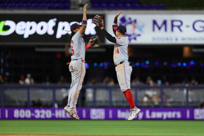 Apr 29, 2024; Miami, Florida, USA; Washington Nationals shortstop CJ Abrams (5) and second baseman Ildemaro Vargas (14) celebrate after the game against the Miami Marlins at loanDepot Park. Mandatory Credit: Sam Navarro-USA TODAY Sports