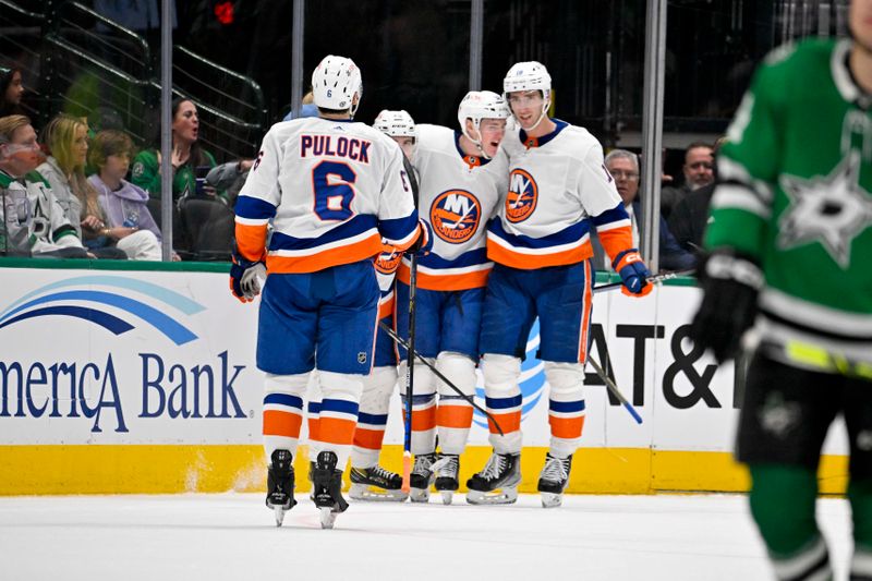 Feb 26, 2024; Dallas, Texas, USA; New York Islanders defenseman Ryan Pulock (6) and defenseman Sebastian Aho (25) and center Kyle MacLean (32) and left wing Pierre Engvall (18) celebrates a goal scored by MacLean against the Dallas Stars during the second period at the American Airlines Center. Mandatory Credit: Jerome Miron-USA TODAY Sports