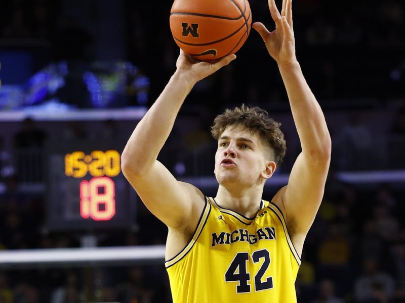 Feb 25, 2024; Ann Arbor, Michigan, USA;  Michigan Wolverines forward Will Tschetter (42) shoots in the first half against the Purdue Boilermakers at Crisler Center. Mandatory Credit: Rick Osentoski-USA TODAY Sports