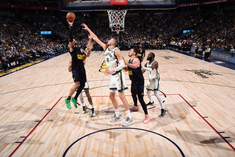 DENVER, CO - MARCH 7: Jamal Murray #27 of the Denver Nuggets drives to the basket during the game against the Boston Celtics on March 7, 2024 at the Ball Arena in Denver, Colorado. NOTE TO USER: User expressly acknowledges and agrees that, by downloading and/or using this Photograph, user is consenting to the terms and conditions of the Getty Images License Agreement. Mandatory Copyright Notice: Copyright 2024 NBAE (Photo by Garrett Ellwood/NBAE via Getty Images)