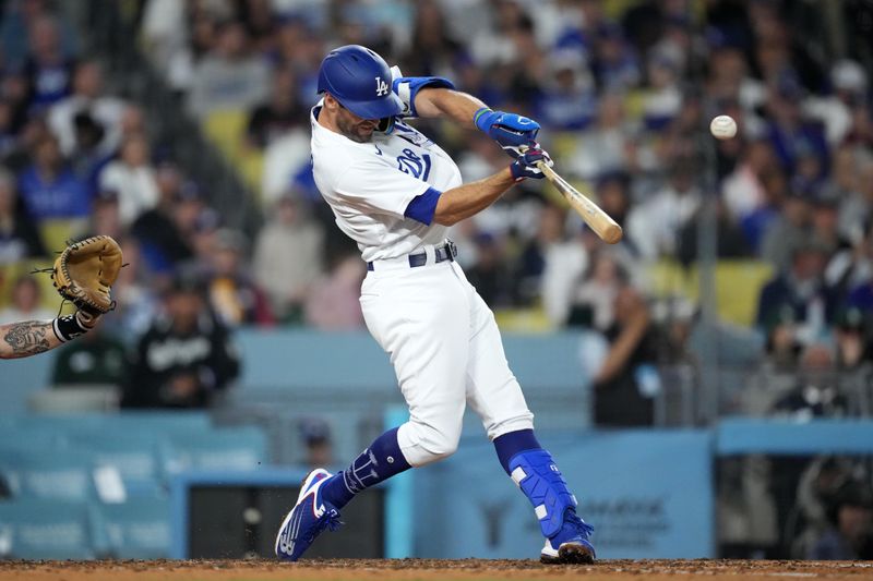 Jun 15, 2023; Los Angeles, California, USA; Los Angeles Dodgers third baseman Chris Taylor (3) follows through on a grand slam home run in the sixth inning against the Chicago White Sox at Dodger Stadium. Mandatory Credit: Kirby Lee-USA TODAY Sports