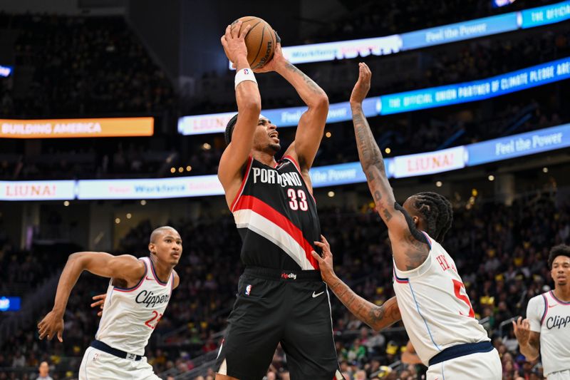 SEATTLE, WASHINGTON - OCTOBER 11: Toumani Camara #33 of the Portland Trail Blazers shoots the ball during the fourth quarter of the Rain City Showcase game against the LA Clippers at Climate Pledge Arena on October 11, 2024 in Seattle, Washington. The LA Clippers won 101-99. NOTE TO USER: User expressly acknowledges and agrees that, by downloading and or using this photograph, User is consenting to the terms and conditions of the Getty Images License Agreement. (Photo by Alika Jenner/Getty Images)