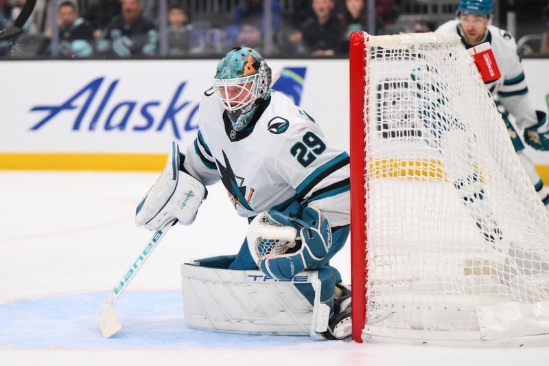 Nov 30, 2024; Seattle, Washington, USA; San Jose Sharks goaltender Mackenzie Blackwood (29) defends the goal against the Seattle Kraken during the second period at Climate Pledge Arena. Mandatory Credit: Steven Bisig-Imagn Images