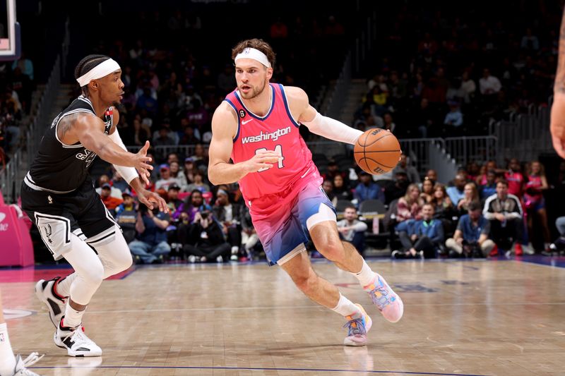 WASHINGTON, DC -? MARCH 24: Corey Kispert #24 of the Washington Wizards drives to the basket against the San Antonio Spurs on March 24, 2023 at Capital One Arena in Washington, DC. NOTE TO USER: User expressly acknowledges and agrees that, by downloading and or using this Photograph, user is consenting to the terms and conditions of the Getty Images License Agreement. Mandatory Copyright Notice: Copyright 2023 NBAE (Photo by Stephen Gosling/NBAE via Getty Images)