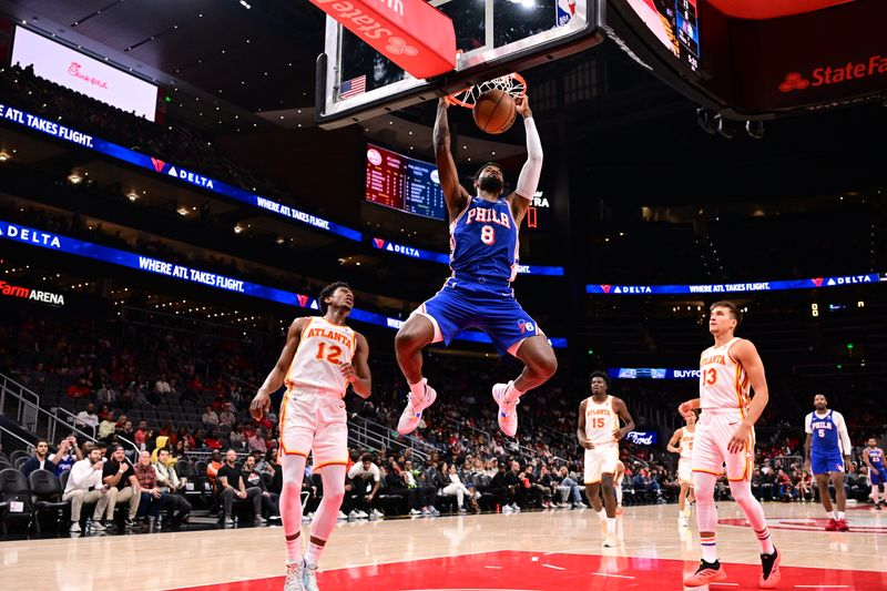 ATLANTA, GA - OCTOBER 14: Paul George #8 of the Philadelphia 76ers dunks the ball during the game against the Atlanta Hawks  during a preseason game on October 14, 2024 at State Farm Arena in Atlanta, Georgia.  NOTE TO USER: User expressly acknowledges and agrees that, by downloading and/or using this Photograph, user is consenting to the terms and conditions of the Getty Images License Agreement. Mandatory Copyright Notice: Copyright 2024 NBAE (Photo by Adam Hagy/NBAE via Getty Images)