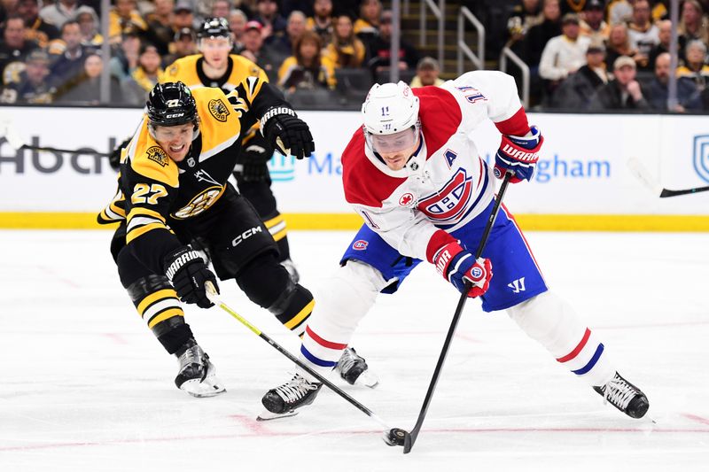 Oct 10, 2024; Boston, Massachusetts, USA; Boston Bruins defenseman Hampus Lindholm (27) defends Montreal Canadiens right wing Brendan Gallagher (11) during the second period at TD Garden. Mandatory Credit: Bob DeChiara-Imagn Images