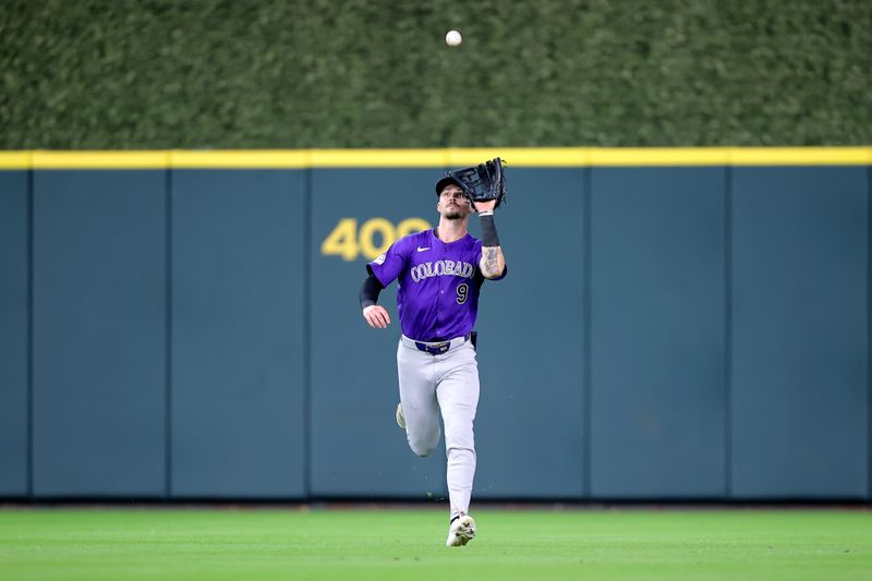 Jun 26, 2024; Houston, Texas, USA; Colorado Rockies center fielder Brenton Doyle (9) catches a fly ball for an out against the Houston Astros during the second inning at Minute Maid Park. Mandatory Credit: Erik Williams-USA TODAY Sports