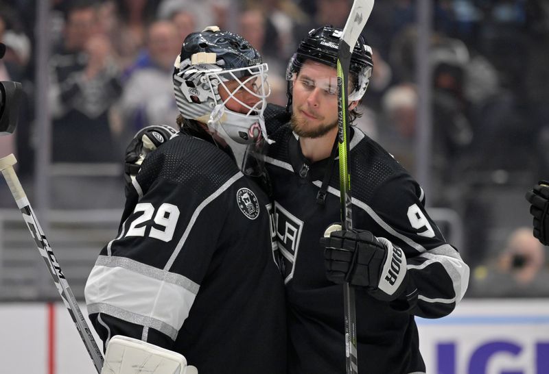 Feb 11, 2023; Los Angeles, California, USA;  Los Angeles Kings goaltender Pheonix Copley (29) is congratulated by Los Angeles Kings right wing Adrian Kempe (9) after a shutout against the Pittsburgh Penguins at Crypto.com Arena. Kempe scored four goals in the game as the first player in Kings franchise history to accomplish that record. Mandatory Credit: Jayne Kamin-Oncea-USA TODAY Sports