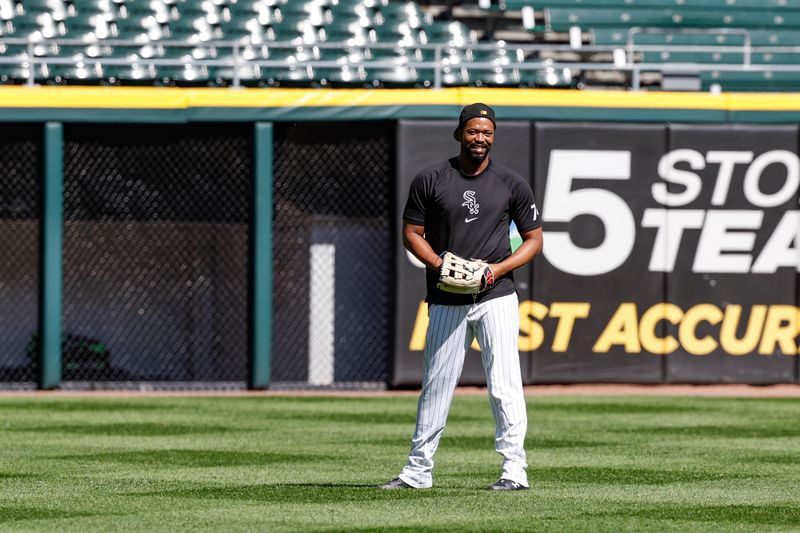 May 27, 2024; Chicago, Illinois, USA; Injured Chicago White Sox designated hitter Eloy Jimenez warms up before a baseball game against the Toronto Blue Jays at Guaranteed Rate Field. Mandatory Credit: Kamil Krzaczynski-USA TODAY Sports