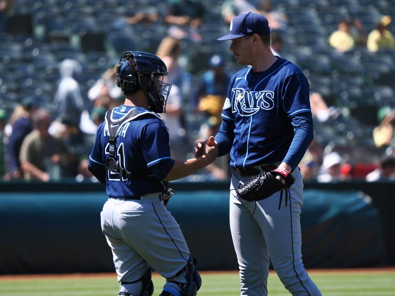 Jun 15, 2023; Oakland, California, USA; Tampa Bay Rays catcher Francisco Mejia (21) celebrates with relief pitcher Pete Fairbanks (29) after a win against the Oakland Athletics at Oakland-Alameda County Coliseum. Mandatory Credit: Kelley L Cox-USA TODAY Sports