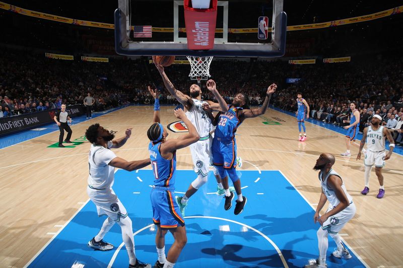 OKLAHOMA CITY, OK - JANUARY 29: Rudy Gobert #27 of the Minnesota Timberwolves drives to the basket during the game Oklahoma City Thunder on January 29, 2024 at Paycom Arena in Oklahoma City, Oklahoma. NOTE TO USER: User expressly acknowledges and agrees that, by downloading and or using this photograph, User is consenting to the terms and conditions of the Getty Images License Agreement. Mandatory Copyright Notice: Copyright 2024 NBAE (Photo by Zach Beeker/NBAE via Getty Images)