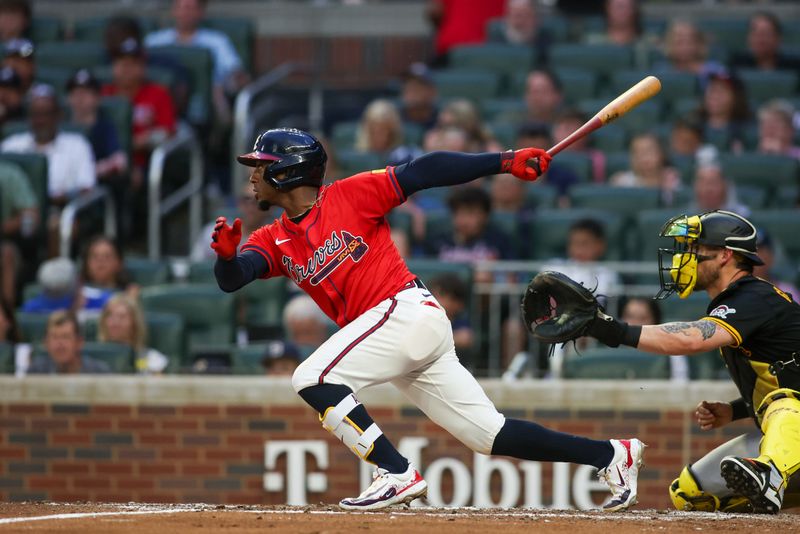 Jun 28, 2024; Atlanta, Georgia, USA; Atlanta Braves second baseman Ozzie Albies (1) hits a double against the Pittsburgh Pirates in the fourth inning at Truist Park. Mandatory Credit: Brett Davis-USA TODAY Sports
