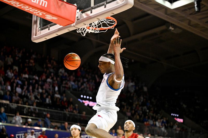 Feb 17, 2026; Dallas, Texas, USA; SMU Mustangs guard Jaron Pierre Jr. (5) dunks the ball against the Louisville Cardinals during the second half at Moody Coliseum. Mandatory Credit: Jerome Miron-Imagn Images