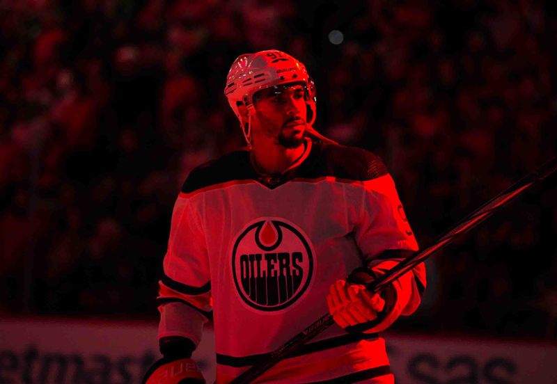 Nov 22, 2023; Raleigh, North Carolina, USA; Edmonton Oilers left wing Evander Kane (91) looks on before the start of the game against the Carolina Hurricanes at PNC Arena. Mandatory Credit: James Guillory-USA TODAY Sports