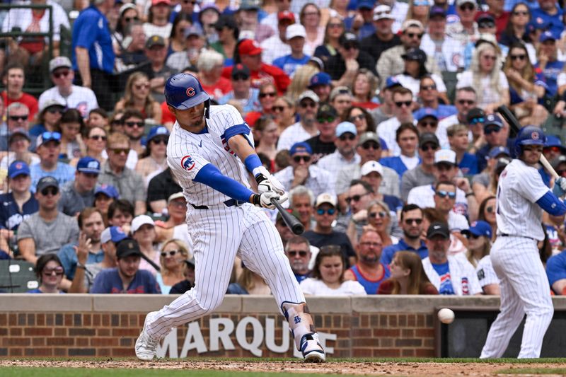 Jun 15, 2024; Chicago, Illinois, USA;  Chicago Cubs outfielder Seiya Suzuki (27) singles against the St. Louis Cardinals during the fourth inning at Wrigley Field. Mandatory Credit: Matt Marton-USA TODAY Sports