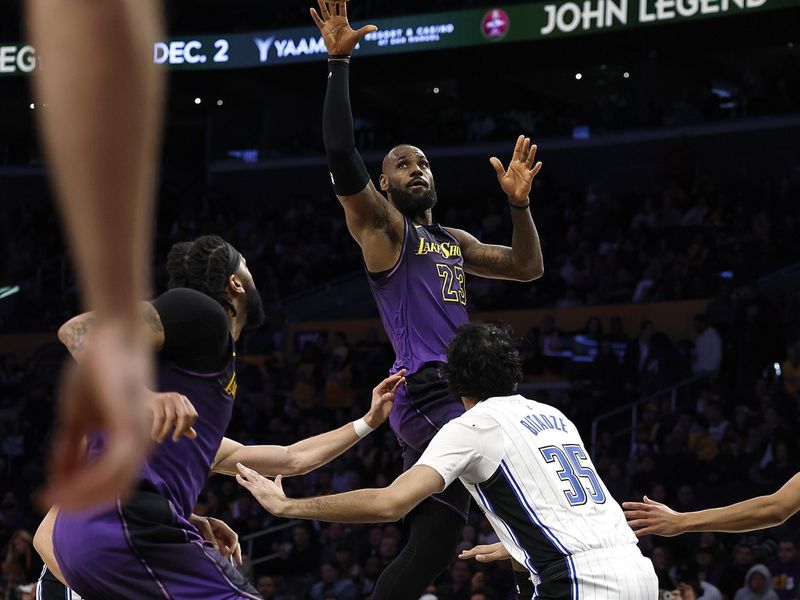 LOS ANGELES, CALIFORNIA - NOVEMBER 21:  LeBron James #23 of the Los Angeles Lakers takes a shot against the Orlando Magic in the second half at Crypto.com Arena on November 21, 2024 in Los Angeles, California.  NOTE TO USER: User expressly acknowledges and agrees that, by downloading and/or using this photograph, user is consenting to the terms and conditions of the Getty Images License Agreement. (Photo by Ronald Martinez/Getty Images)