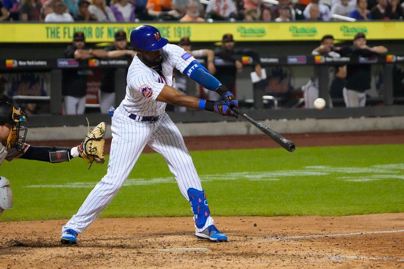 Jul 2, 2023; New York City, New York, USA; New York Mets right fielder Starling Marte (6) hits an RBI single against the San Francisco Giants during the seventh inning at Citi Field. Mandatory Credit: Gregory Fisher-USA TODAY Sports