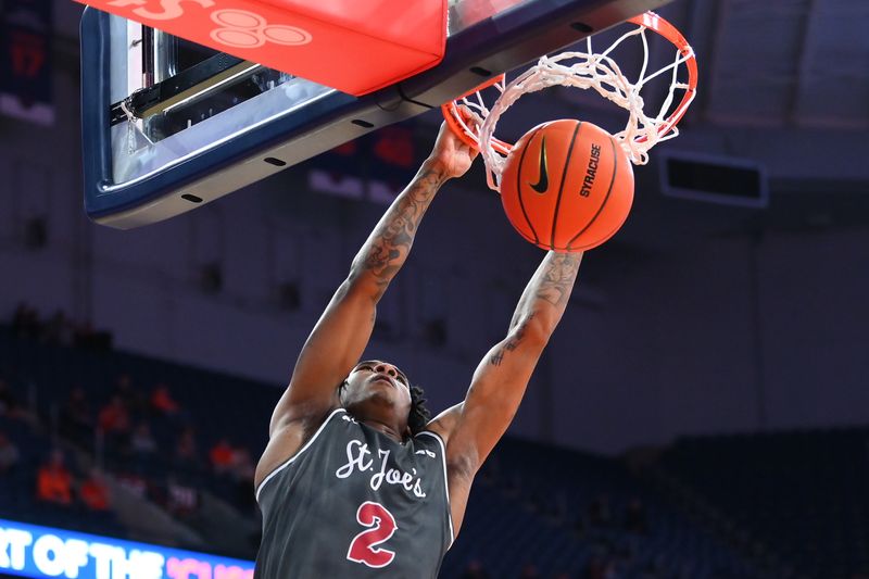 Dec 11, 2025; Syracuse, New York, USA; Saint Joseph's Hawks guard Deuce Jones (2) dunks against the Syracuse Orange during the first half at the JMA Wireless Dome. Mandatory Credit: Rich Barnes-Imagn Images