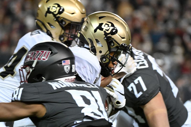 Nov 17, 2023; Pullman, Washington, USA; Colorado Buffaloes wide receiver Jimmy Horn Jr. (5) is tackled during a kick return by Washington State Cougars wide receiver Tsion Nunnally (81) in the first half at Gesa Field at Martin Stadium. Mandatory Credit: James Snook-USA TODAY Sports