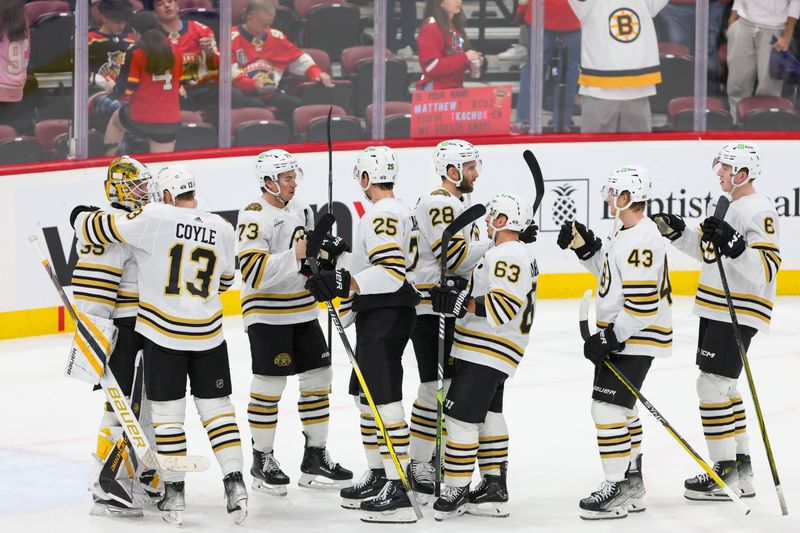 Nov 22, 2023; Sunrise, Florida, USA; The Boston Bruins celebrate after winning the game against the Florida Panthers at Amerant Bank Arena. Mandatory Credit: Sam Navarro-USA TODAY Sports