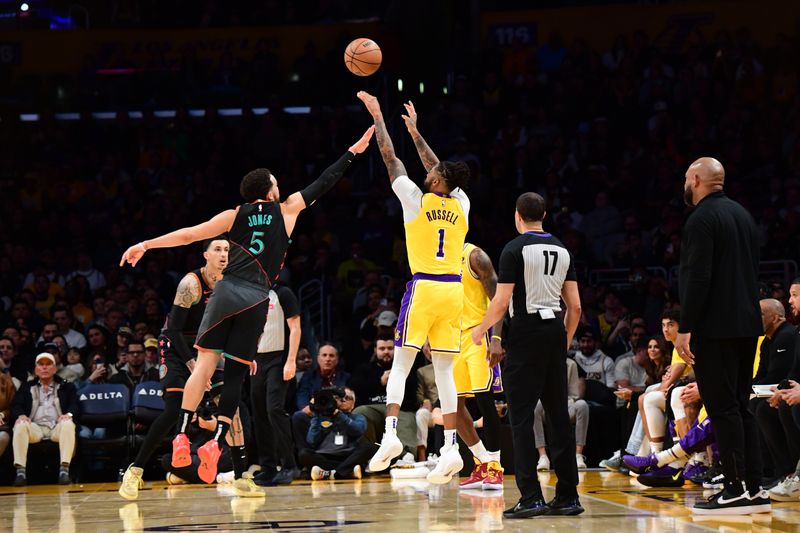 LOS ANGELES, CA - FEBRUARY 29: D'Angelo Russell #1 of the Los Angeles Lakers shoots a three point basket during the game against the Washington Wizards on February 29, 2024 at Crypto.Com Arena in Los Angeles, California. NOTE TO USER: User expressly acknowledges and agrees that, by downloading and/or using this Photograph, user is consenting to the terms and conditions of the Getty Images License Agreement. Mandatory Copyright Notice: Copyright 2024 NBAE (Photo by Adam Pantozzi/NBAE via Getty Images)