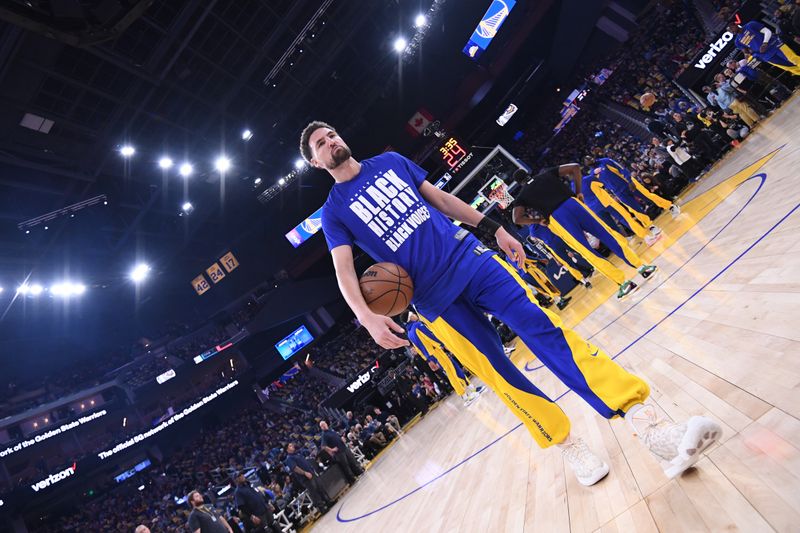 SAN FRANCISCO, CA - FEBRUARY 25: Klay Thompson #11 of the Golden State Warriors looks on during the game against the Denver Nuggets on February 25, 2024 at Chase Center in San Francisco, California. NOTE TO USER: User expressly acknowledges and agrees that, by downloading and or using this photograph, user is consenting to the terms and conditions of Getty Images License Agreement. Mandatory Copyright Notice: Copyright 2024 NBAE (Photo by Noah Graham/NBAE via Getty Images)