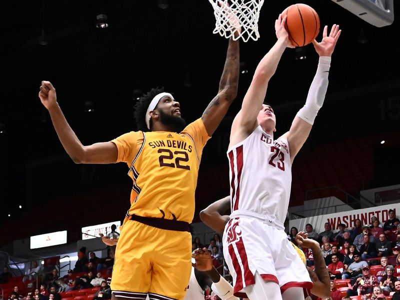 Jan 28, 2023; Pullman, Washington, USA; Washington State Cougars forward Andrej Jakimovski (23) shoots the ball against Arizona State Sun Devils forward Warren Washington (22) in the second half at Friel Court at Beasley Coliseum. Washington State won 75-58. Mandatory Credit: James Snook-USA TODAY Sports