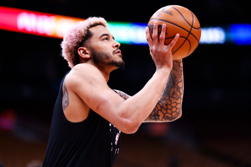 TORONTO, CANADA - MARCH 23: Jeremy Sochan #10 of the San Antonio Spurs warms up before the game against the Toronto Raptors on March 23, 2025 at the Scotiabank Arena in Toronto, Ontario, Canada.  NOTE TO USER: User expressly acknowledges and agrees that, by downloading and or using this Photograph, user is consenting to the terms and conditions of the Getty Images License Agreement.  Mandatory Copyright Notice: Copyright 2025 NBAE (Photo by Vaughn Ridley/NBAE via Getty Images)