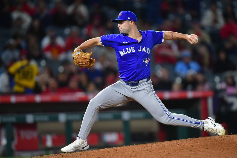May 6, 2025; Anaheim, California, USA; Toronto Blue Jays pitcher Mason Fluharty (68) throws against the Los Angeles Angels during the seventh inning at Angel Stadium. Mandatory Credit: Gary A. Vasquez-Imagn Images