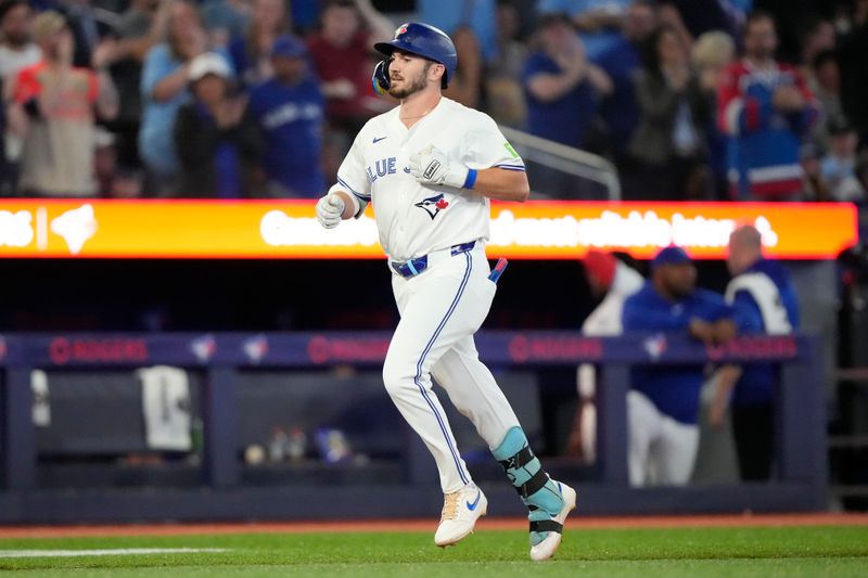 Aug 20, 2024; Toronto, Ontario, CAN; Toronto Blue Jays first baseman Spencer Horwitz (48) heads for home on his solo home run against the Cincinnati Reds during the third inning at Rogers Centre. Mandatory Credit: John E. Sokolowski-USA TODAY Sports