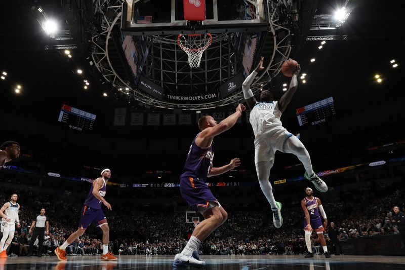 MINNEAPOLIS, MN -  NOVEMBER 17: Julius Randle #30 of the Minnesota Timberwolves drives to the basket during the game against the Phoenix Suns on November 17, 2024 at Target Center in Minneapolis, Minnesota. NOTE TO USER: User expressly acknowledges and agrees that, by downloading and or using this Photograph, user is consenting to the terms and conditions of the Getty Images License Agreement. Mandatory Copyright Notice: Copyright 2024 NBAE (Photo by Jordan Johnson/NBAE via Getty Images)